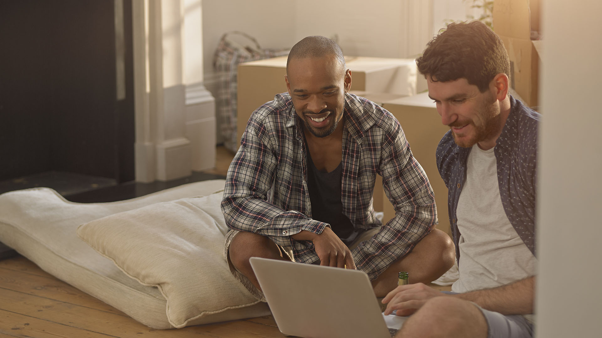 two men looking at a computer learning about 401(k)s